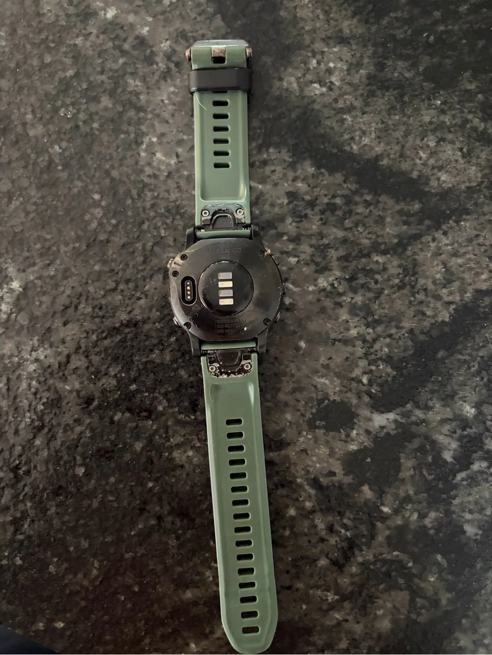 garmin Fenix Smartwatch with Green Silicone Band and Black Bezel